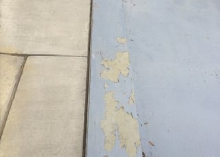 Peeling floor coating due to moisture